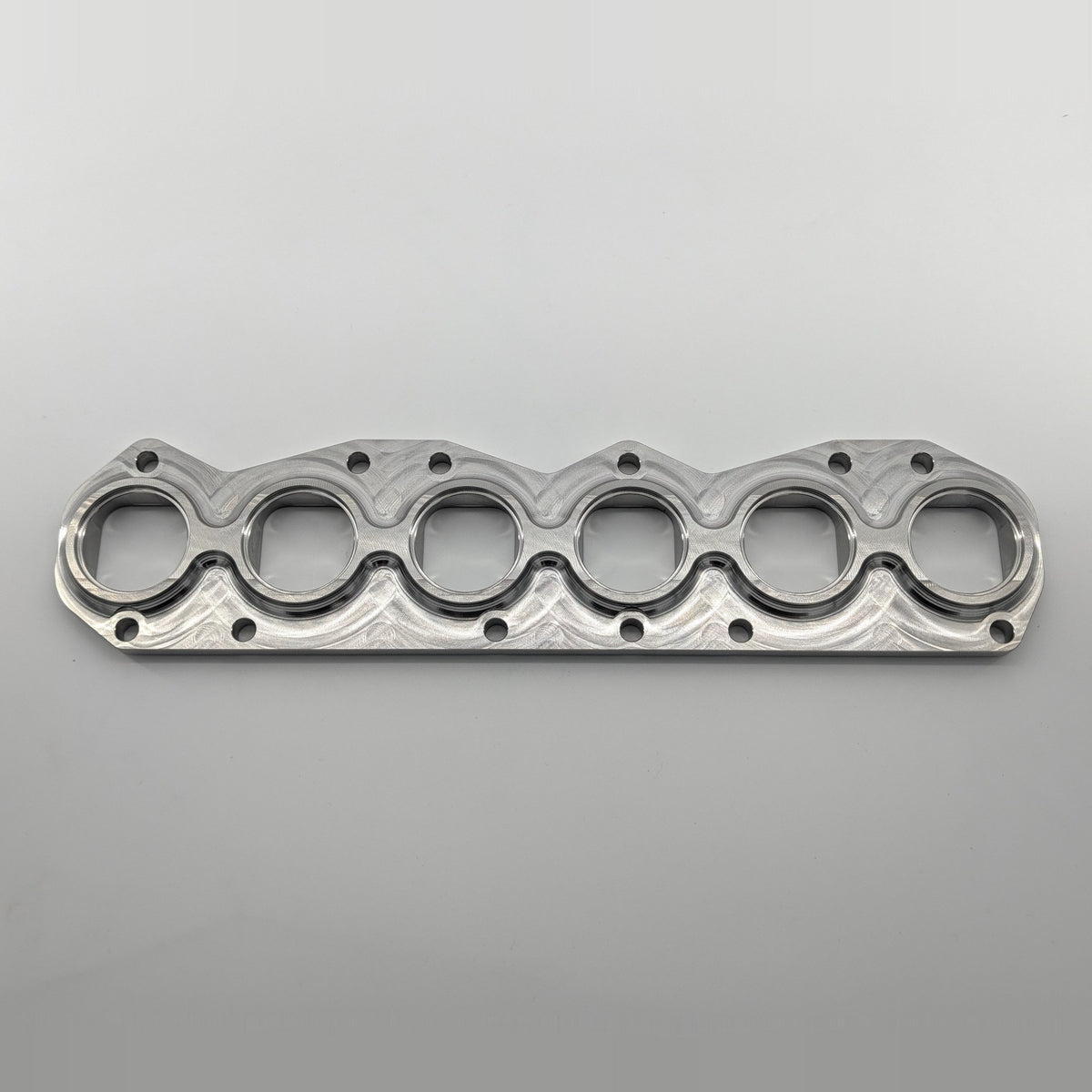 VR6 3.6L 24V exhaust manifold flange small port, tube side top view, CNC machined 304L stainless steel, fits gasket 03H253039E
