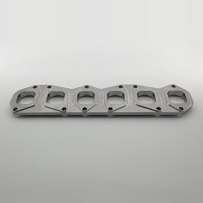VR6 3.6L 24V exhaust manifold flange small port, manifold side angled view, square-to-round port transition, KMC Fabrication made in USA